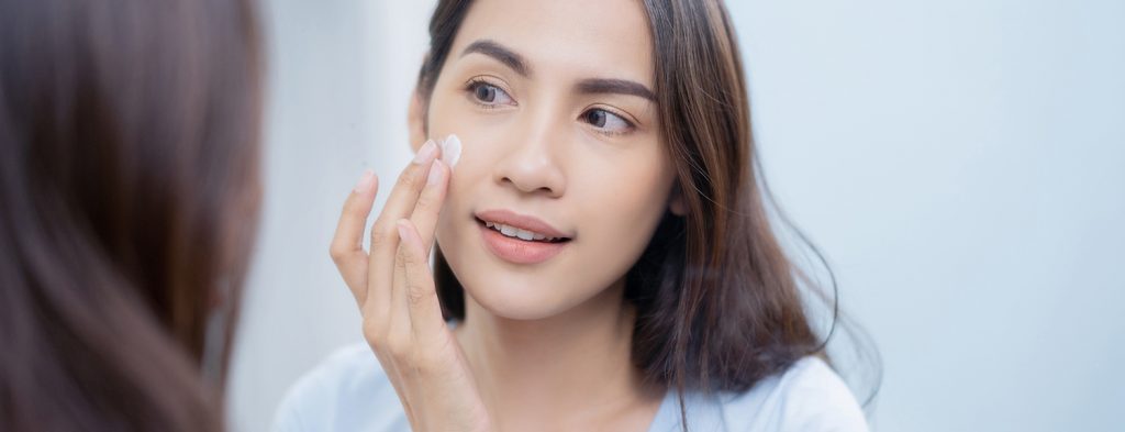 Woman applying cream