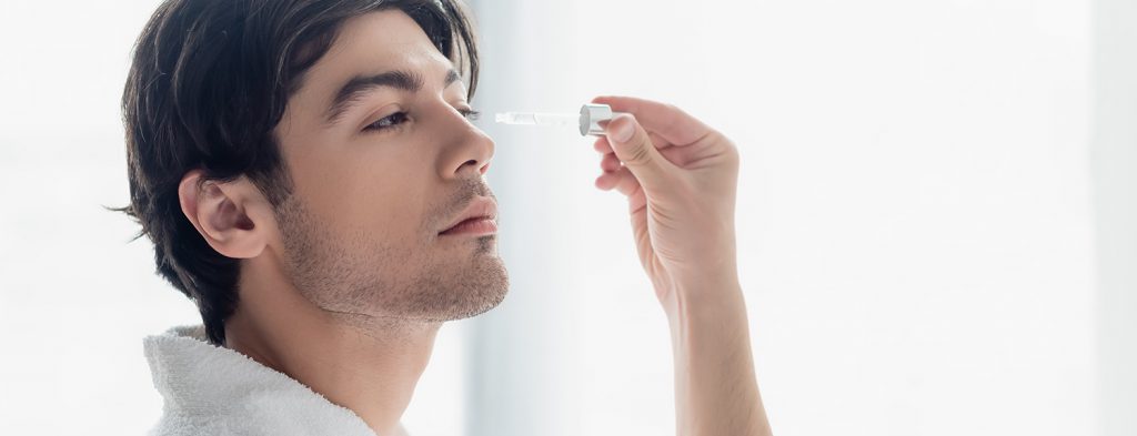 Man applying serum