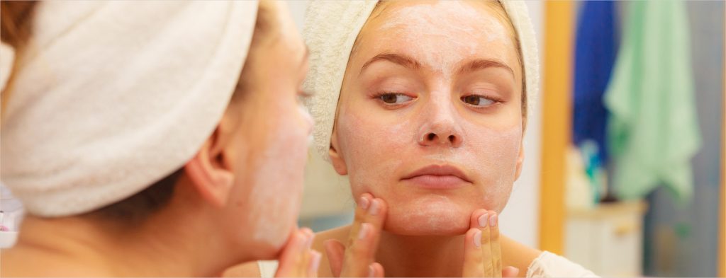Woman applying mask